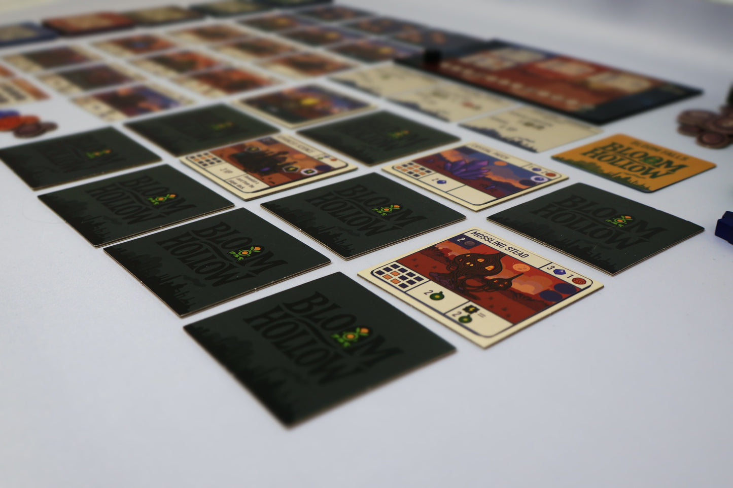 Collection of board game cards on a white surface