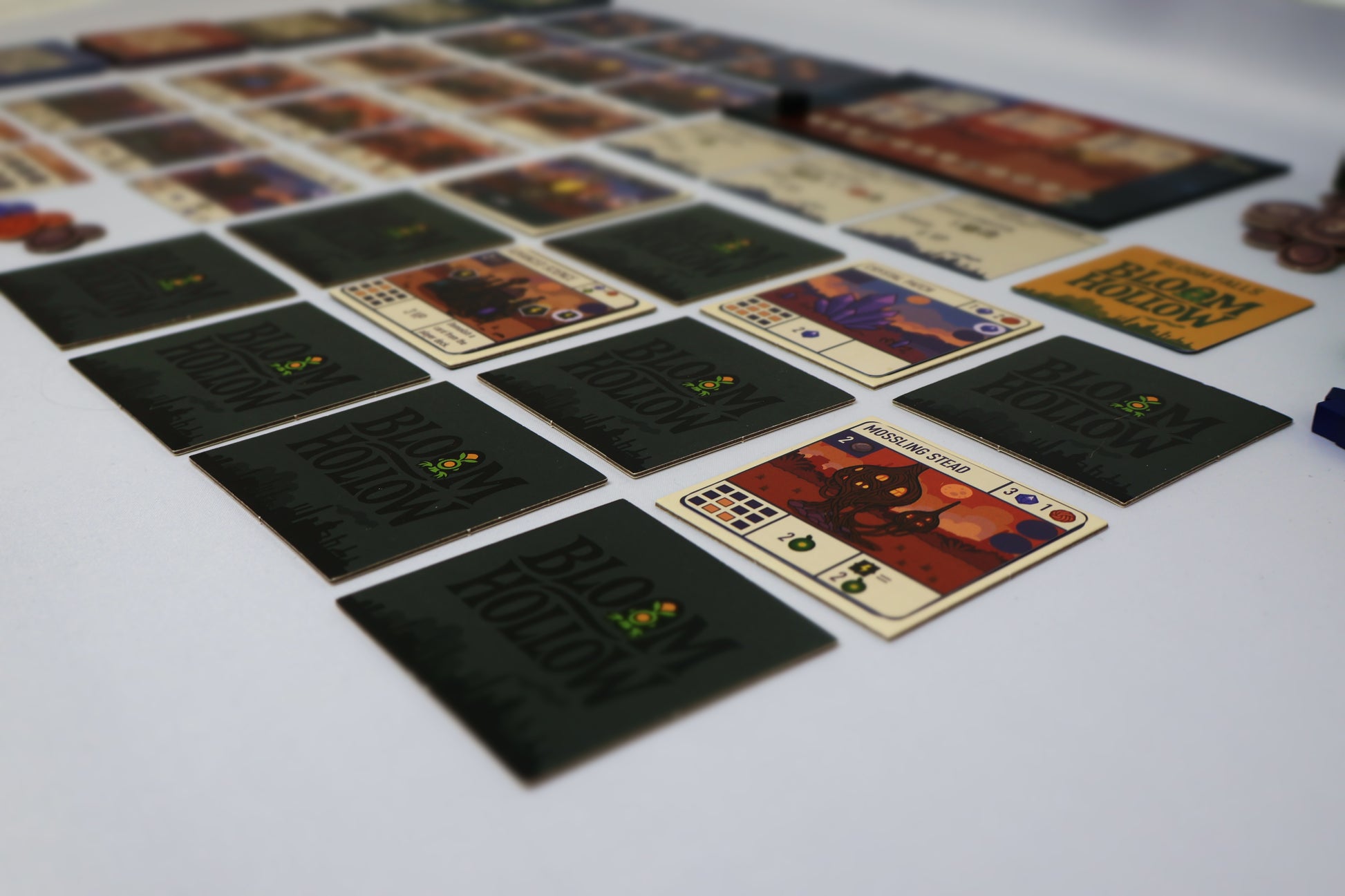 Collection of board game cards on a white surface